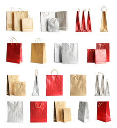 Image of Set of paper shopping bags on white background