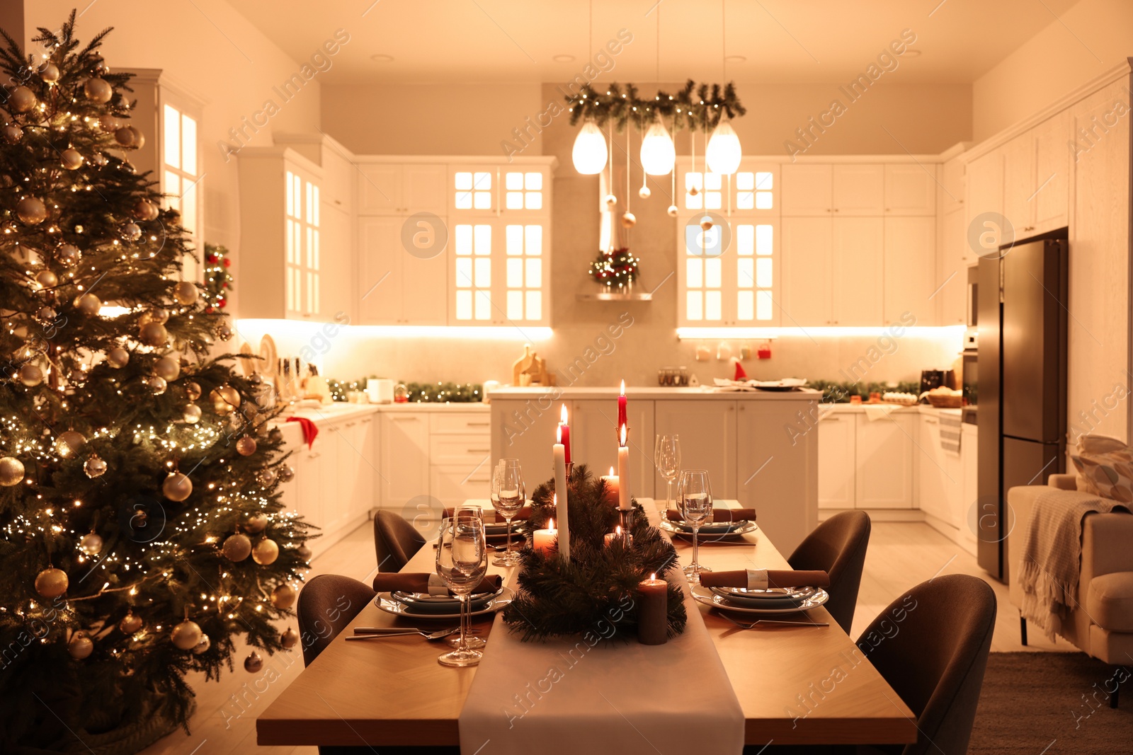 Photo of Cozy spacious kitchen decorated for Christmas. Interior design