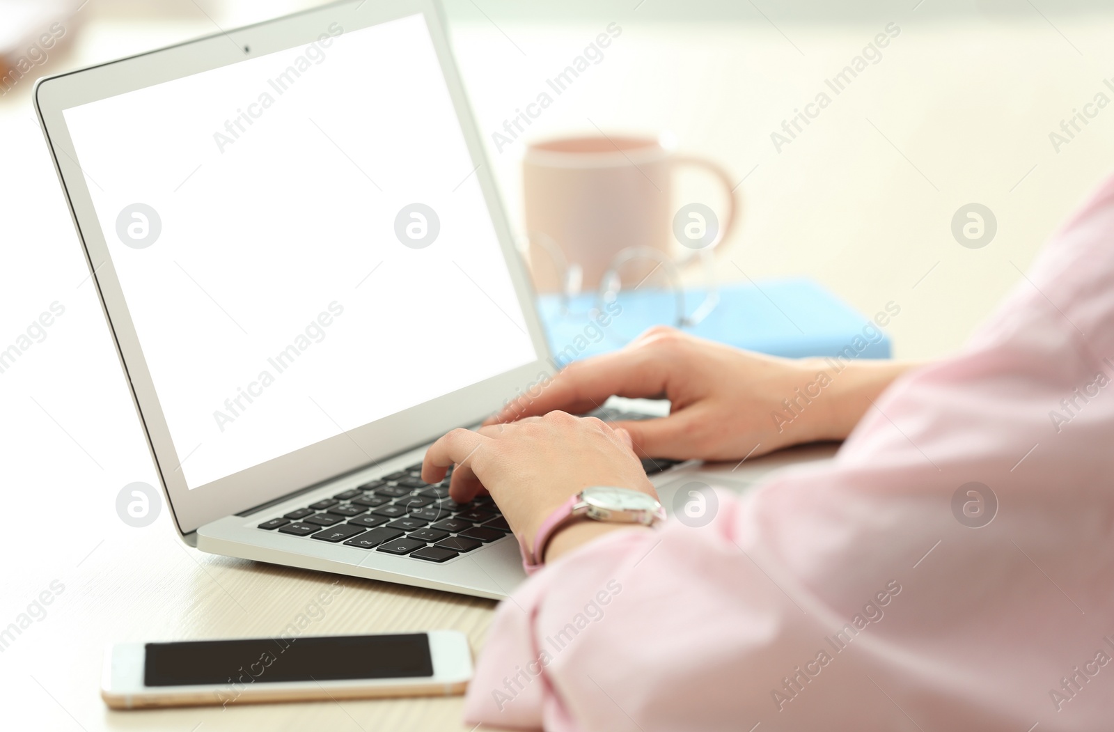 Image of Young woman using modern computer at table indoors, closeup. Space for design