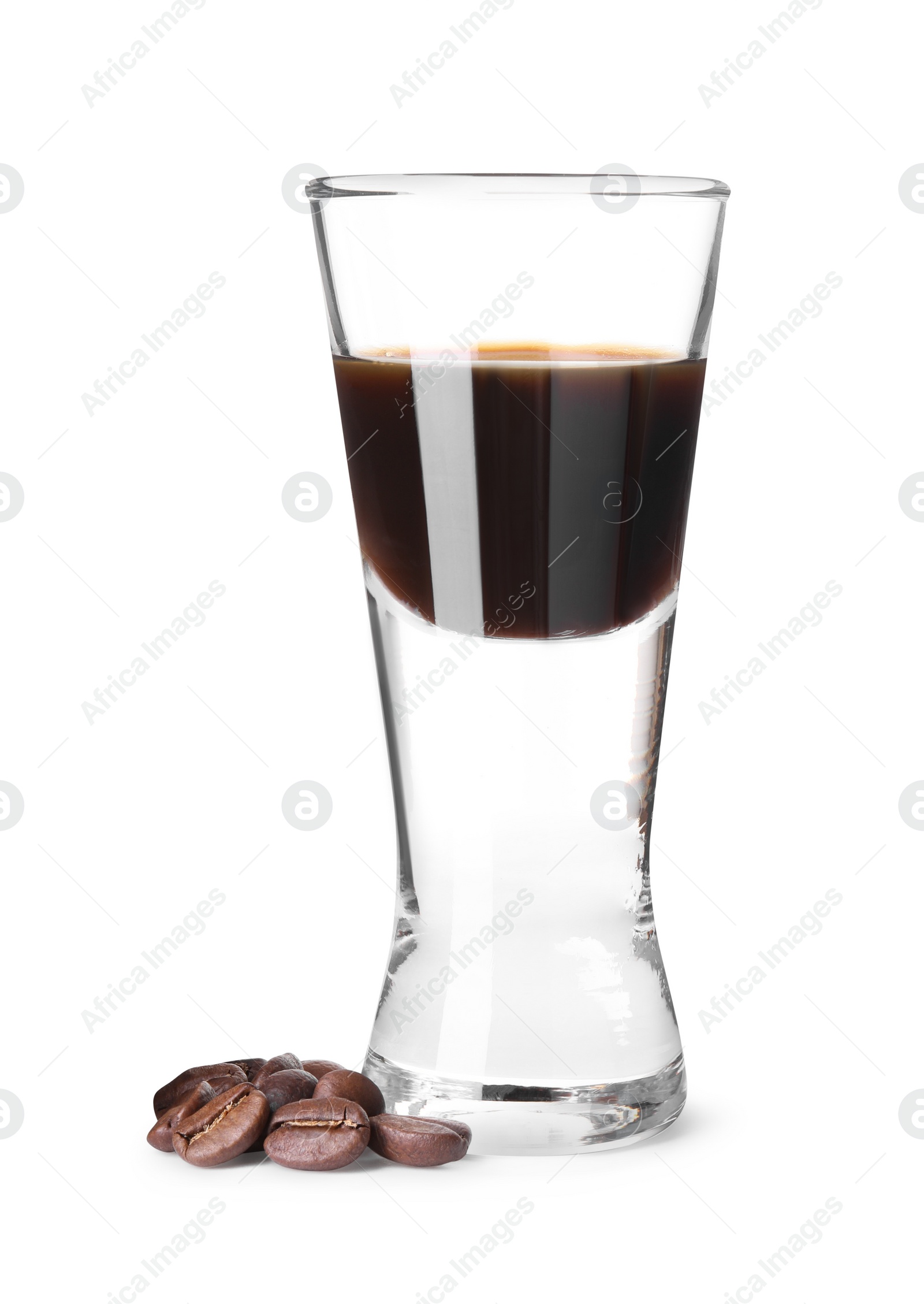 Photo of Shot glass with coffee liqueur and beans isolated on white