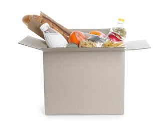 Photo of Cardboard box with donation food isolated on white