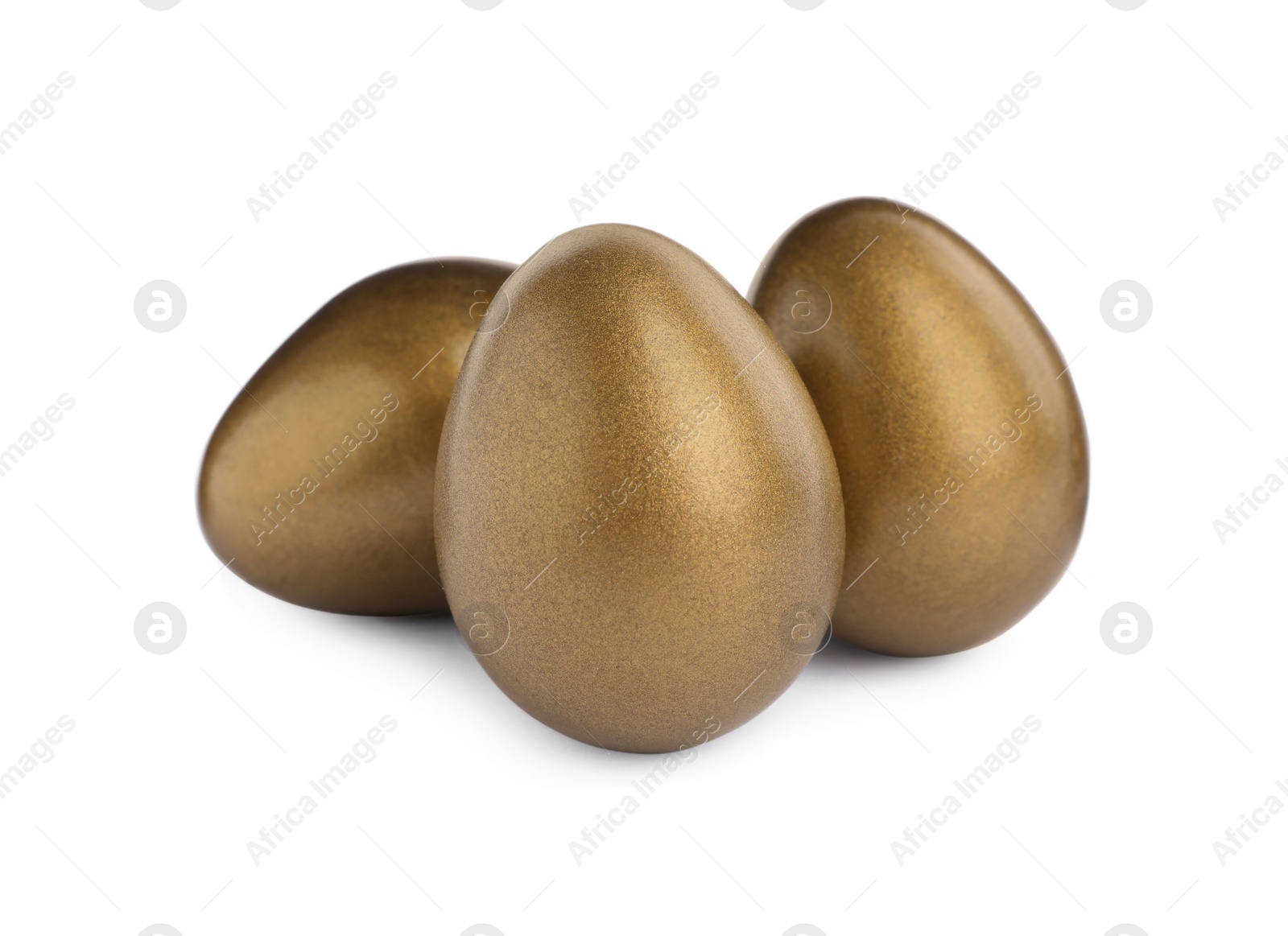 Photo of Many shiny golden eggs on white background