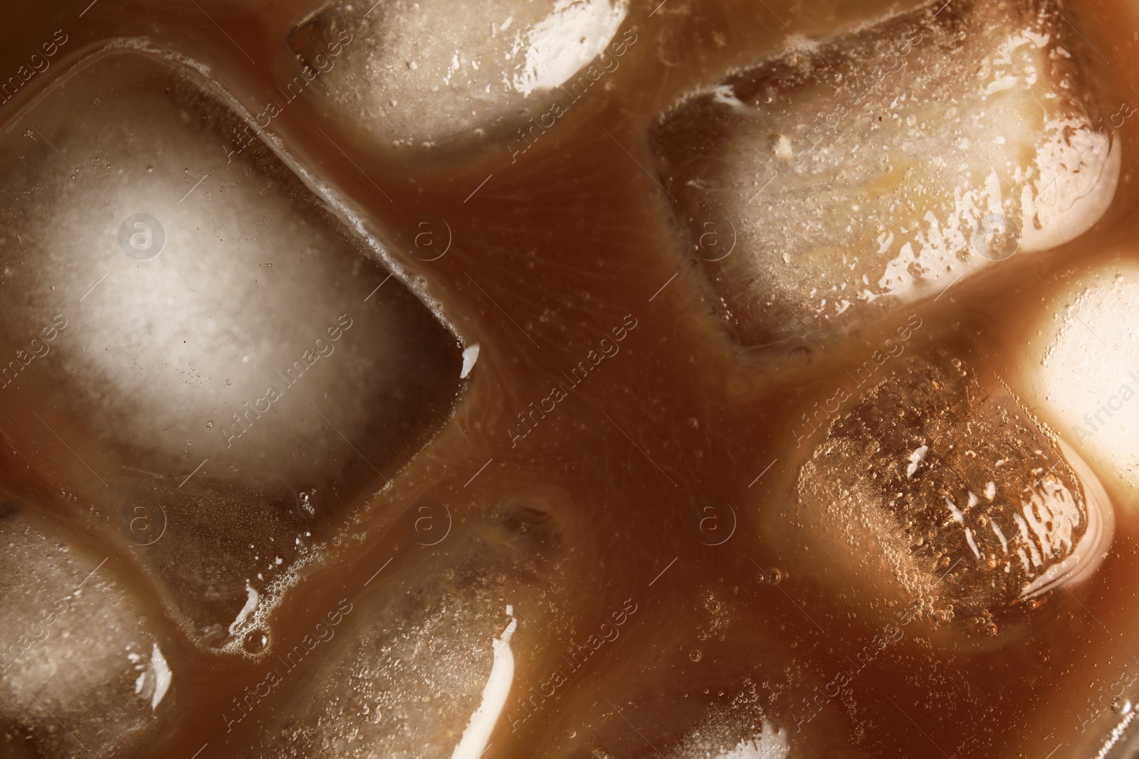 Photo of Tasty coffee with ice cubes, top view