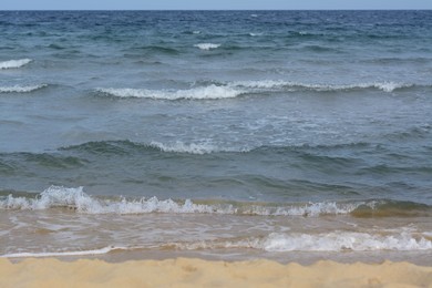 Photo of Beautiful view of sea with waves and sandy beach