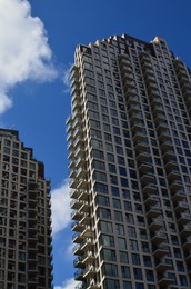 Exterior of beautiful buildings against blue sky, low angle view