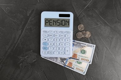 Image of Calculator with word Pension and money on grey table, top view