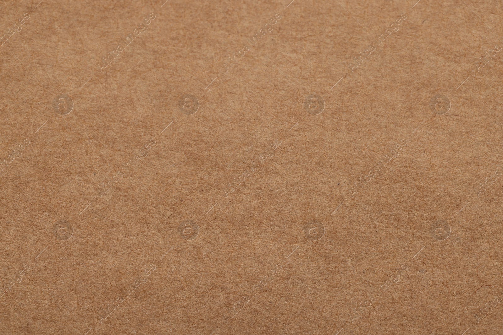 Photo of Texture of brown paper sheet as background, top view