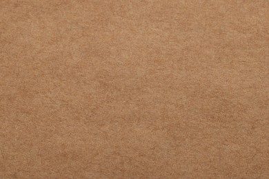 Texture of brown paper sheet as background, top view