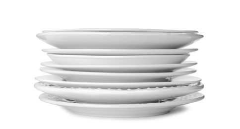 Photo of Stack of clean plates isolated on white