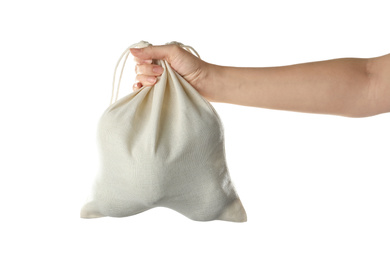 Woman holding full cotton eco bag on white background, closeup