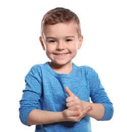 Photo of Little boy showing HELP gesture in sign language on white background