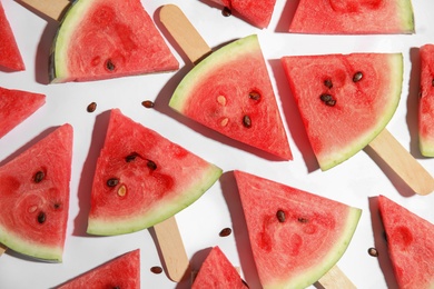 Photo of Slices of ripe watermelon on white background, flat lay