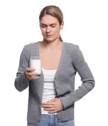 Photo of Woman with glass of milk suffering from lactose intolerance on white background