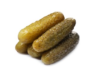 Photo of Pile of tasty pickled cucumbers isolated on white