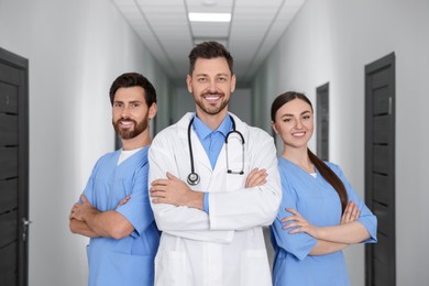 Photo of Teamprofessional doctors in clinic hallway