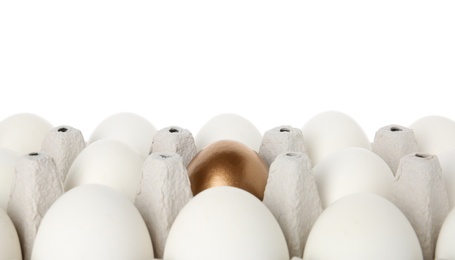 Photo of Egg carton with golden egg among ordinary ones on white background