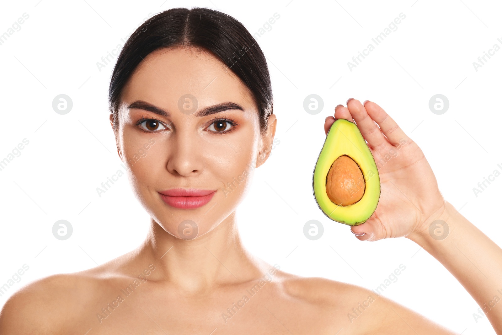 Photo of Young woman with silky skin after face mask holding avocado on white background