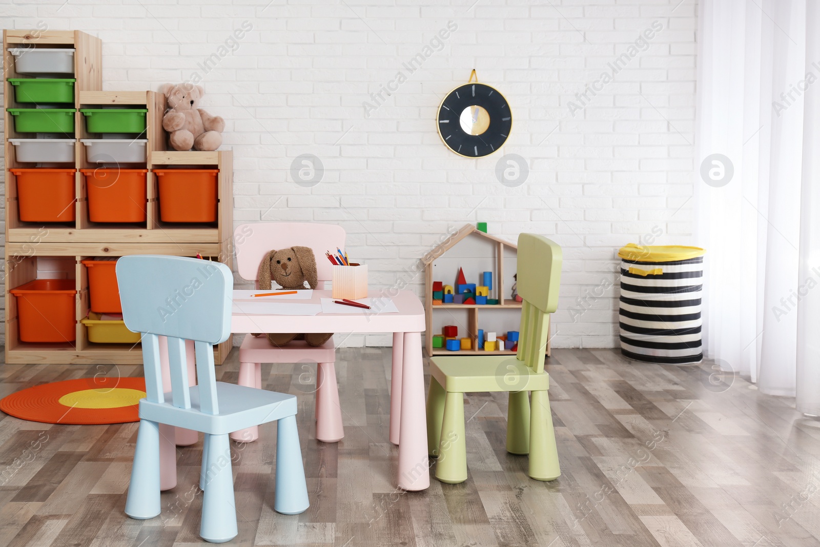 Photo of Modern child room interior with table and chairs