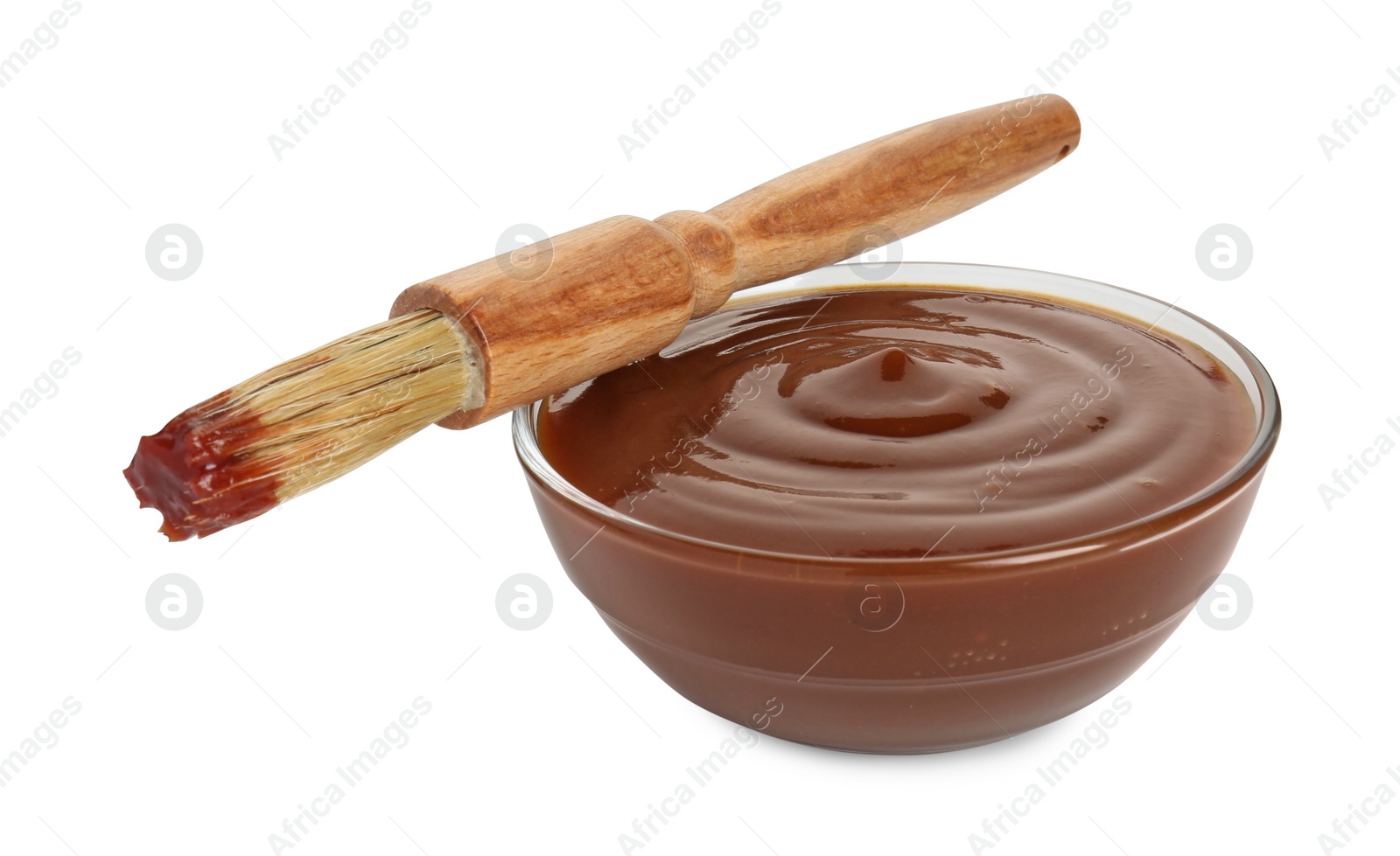 Photo of Tasty barbecue sauce in bowl and brush isolated on white