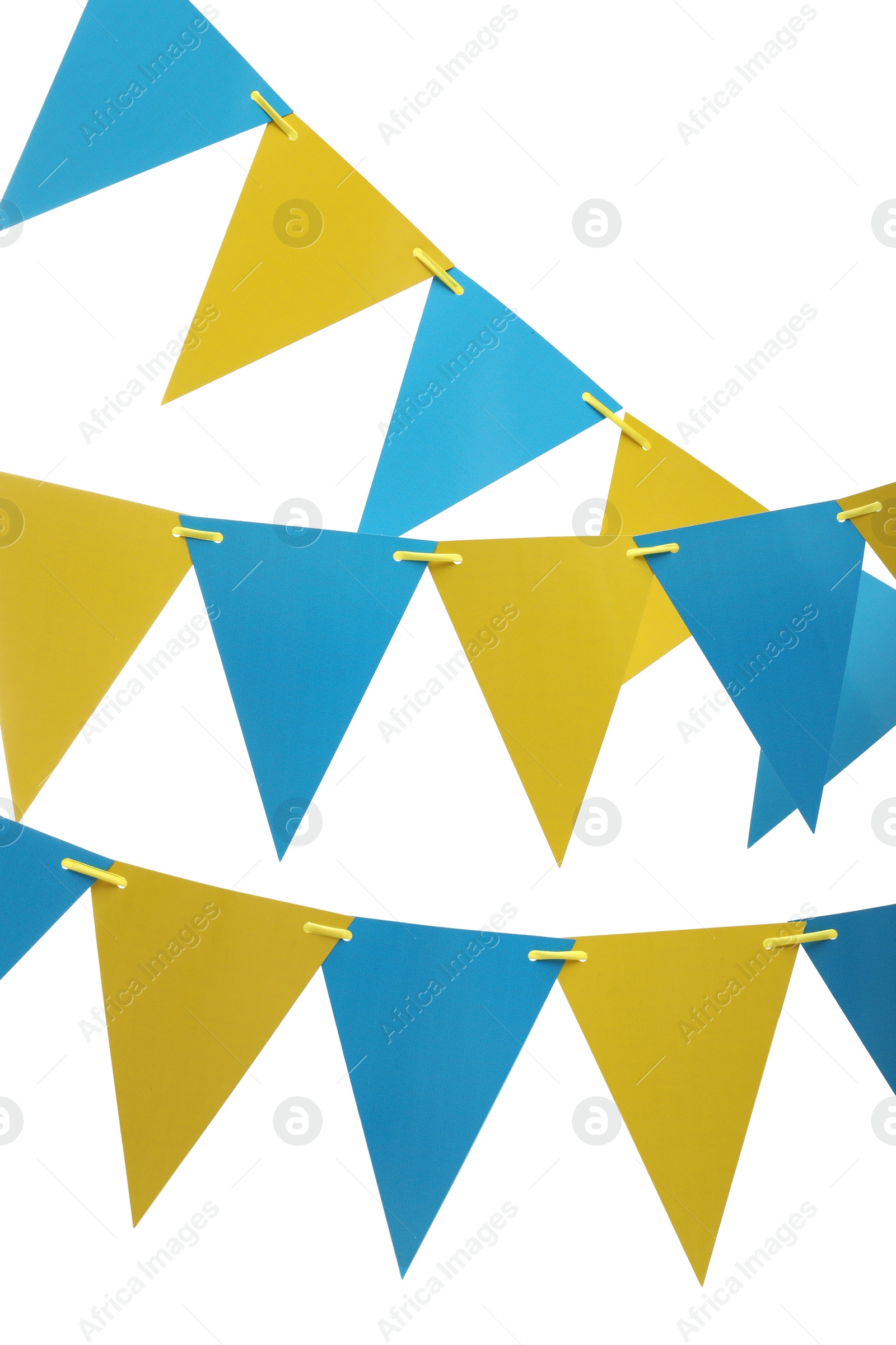 Photo of Rows of triangular bunting flags on white background. Festive decor