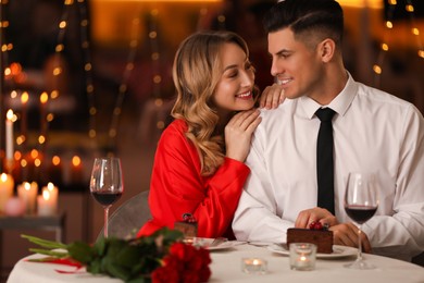 Lovely couple having romantic dinner on Valentine's day in restaurant