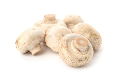 Photo of Fresh raw champignon mushrooms on white background