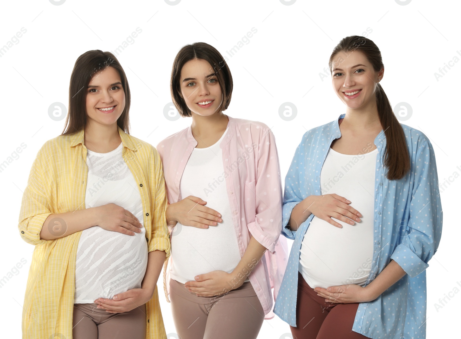 Photo of Happy young pregnant women on white background