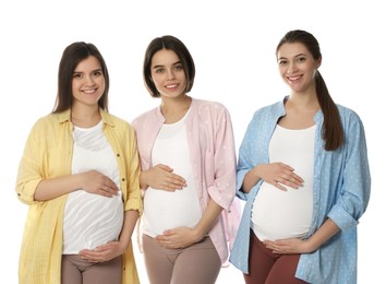 Happy young pregnant women on white background