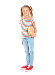 Little child with school supplies on white background