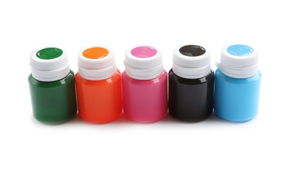 Photo of Jars with colorful paints on white background. Artistic equipment for children