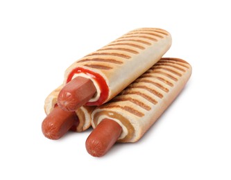 Tasty french hot dogs with different sauces on white background
