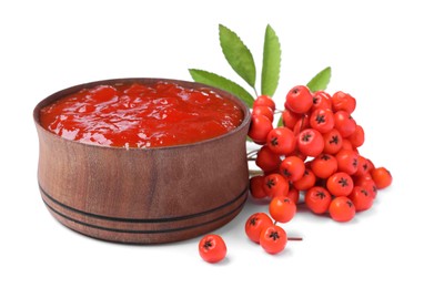 Photo of Delicious rowan jam in wooden bowl and berries on white background