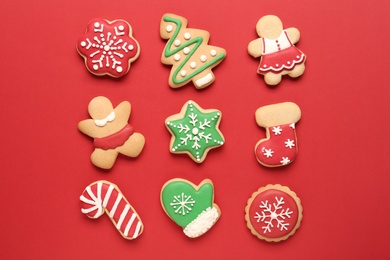 Photo of Flat lay composition with tasty homemade Christmas cookies on red background