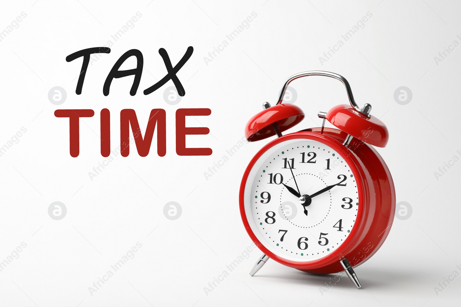 Image of Time to pay taxes. Alarm clock on white background