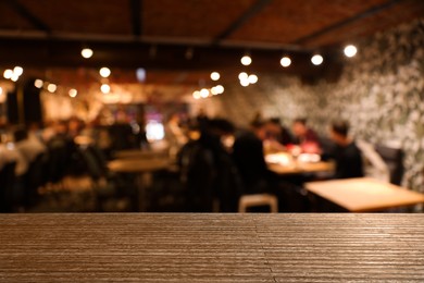 Image of Empty wooden surface in cafe. Space for design