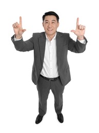 Businessman in suit posing on white background, above view