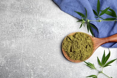 Hemp protein powder and fresh leaves on light grey table, flat lay. Space for text