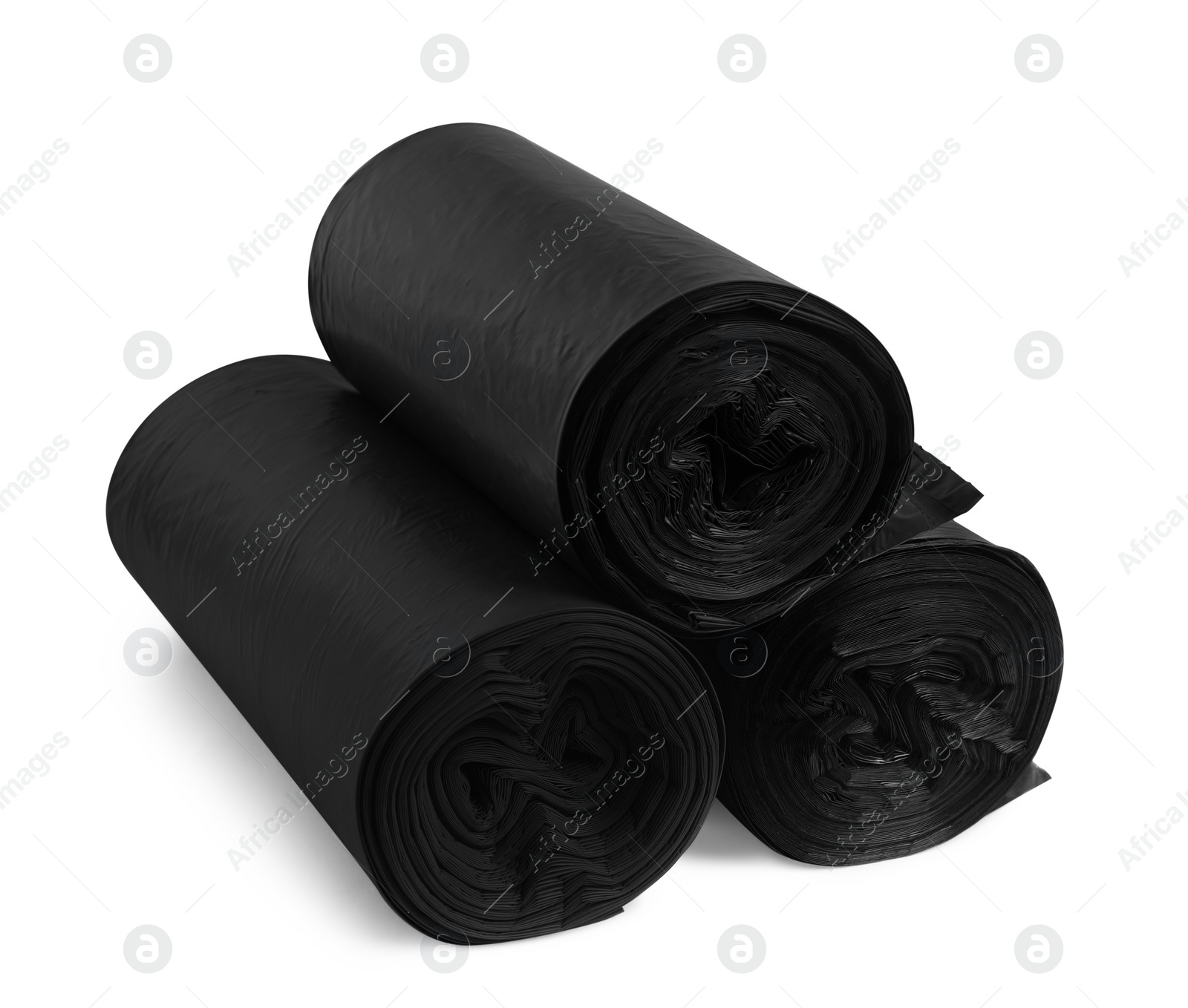 Photo of Rolls of different garbage bags on white background. Cleaning supplies