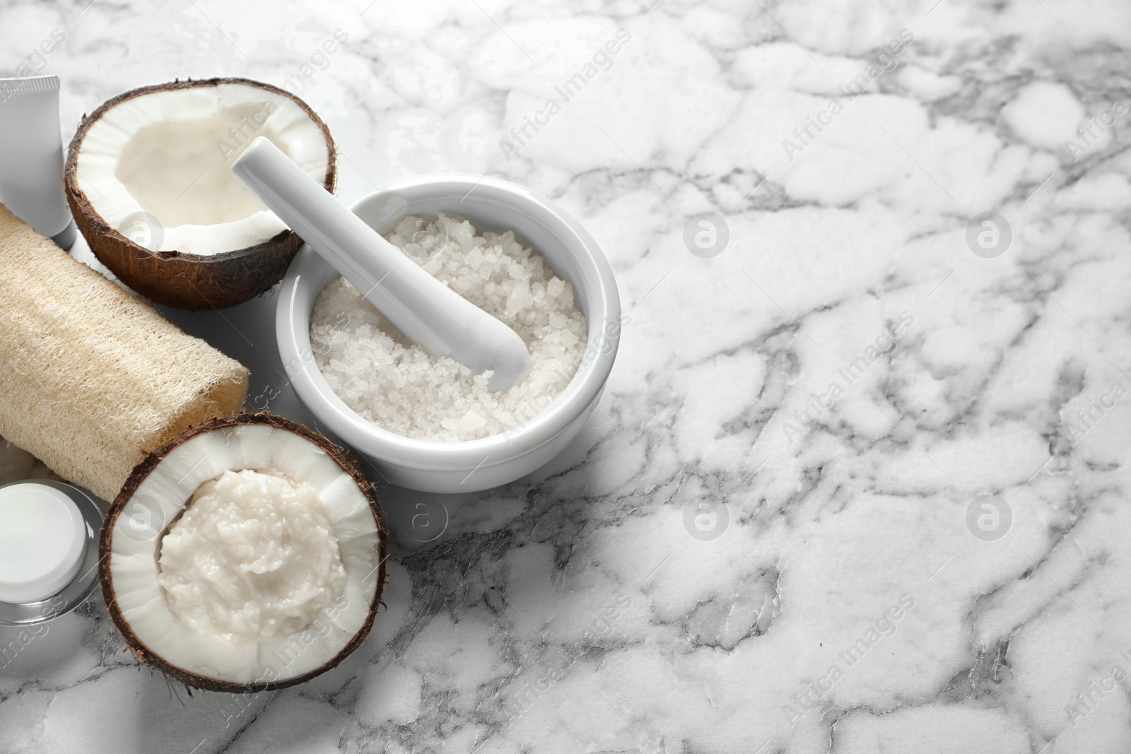 Photo of Composition with handmade natural body scrub in nut on light background