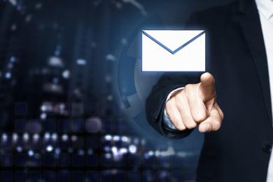 Image of Electronic mail. Businessman pointing at virtual image of envelope, closeup