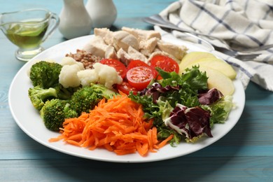 Photo of Balanced diet and healthy foods. Plate with different delicious products on blue wooden table, closeup