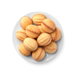 Photo of Plate of delicious nut shaped cookies with condensed milk on white background, top view