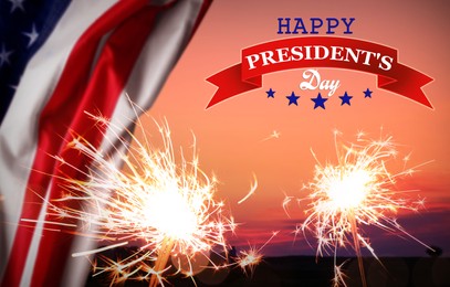 Image of Happy President's Day - federal holiday. Burning sparkler and American flag outdoors