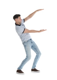 Photo of Man in casual clothes holding something on white background