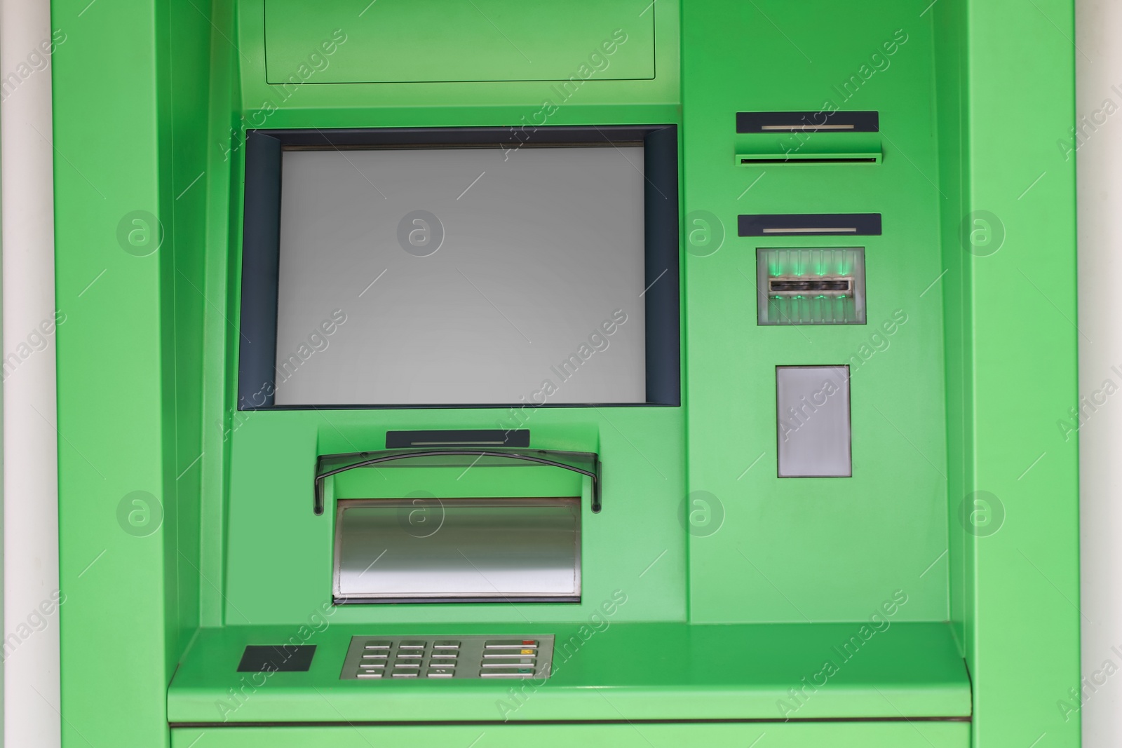 Photo of Modern automated cash machine with screen outdoors