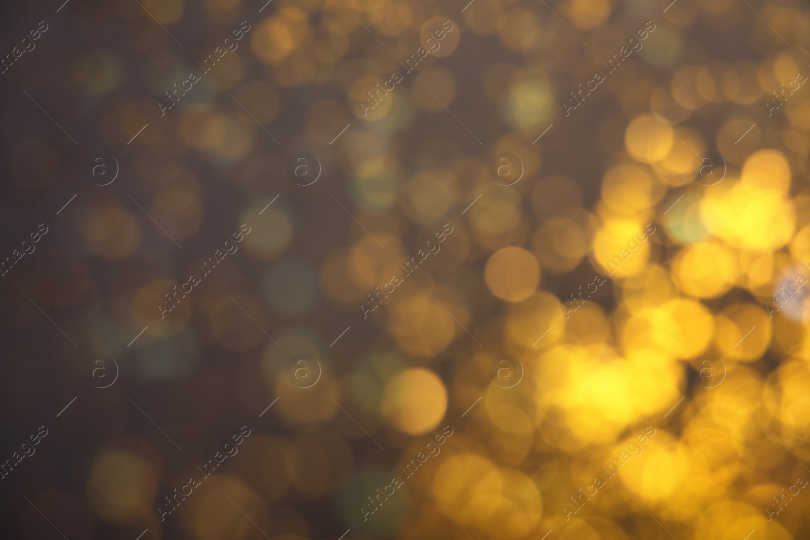 Photo of Blurred view of shiny lights on grey background. Bokeh effect