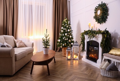 Photo of Beautiful room interior with fireplace and Christmas decor