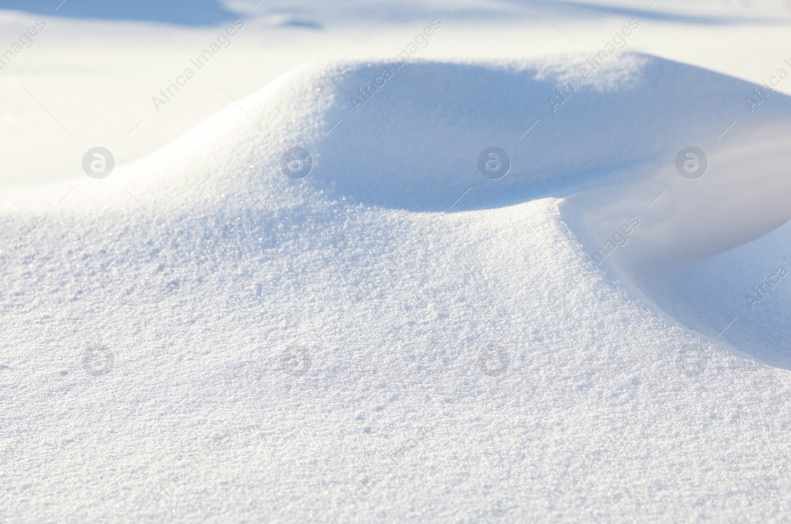 Photo of Beautiful snowdrift as background, closeup view. Winter weather