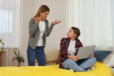 Mother scolding her teenage daughter at home