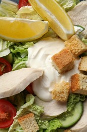 Photo of Delicious salad with Chinese cabbage, meat and bread croutons as background, top view